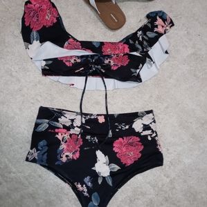 Top is Ruffled with tie up bust & Cheeky bttms.